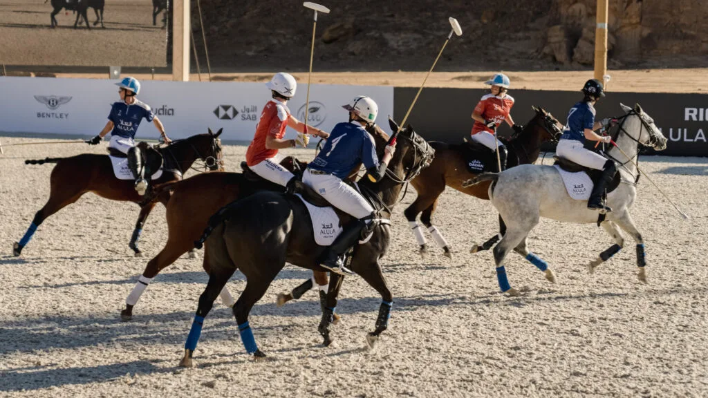 Polo players on horseback.