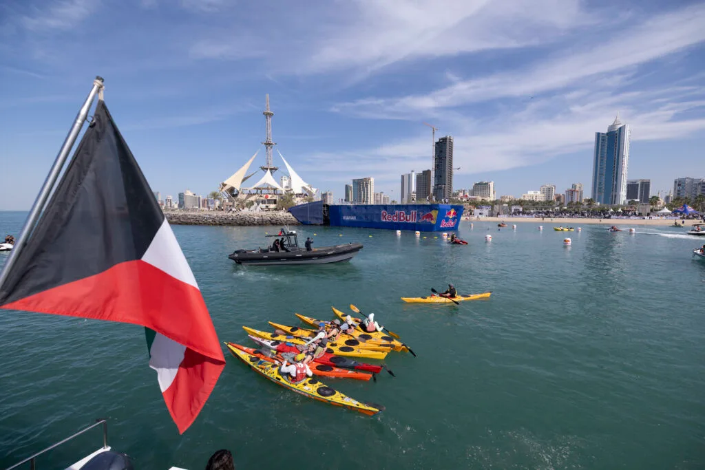 Kayakers near Red Bull barge.