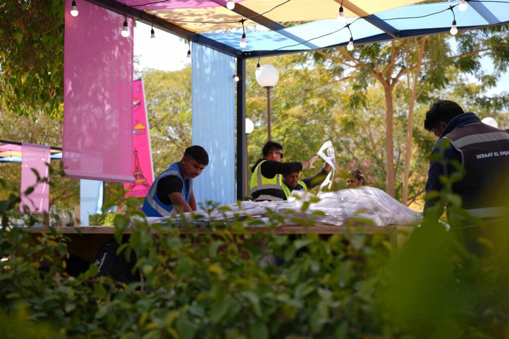 Workers organizing event materials.