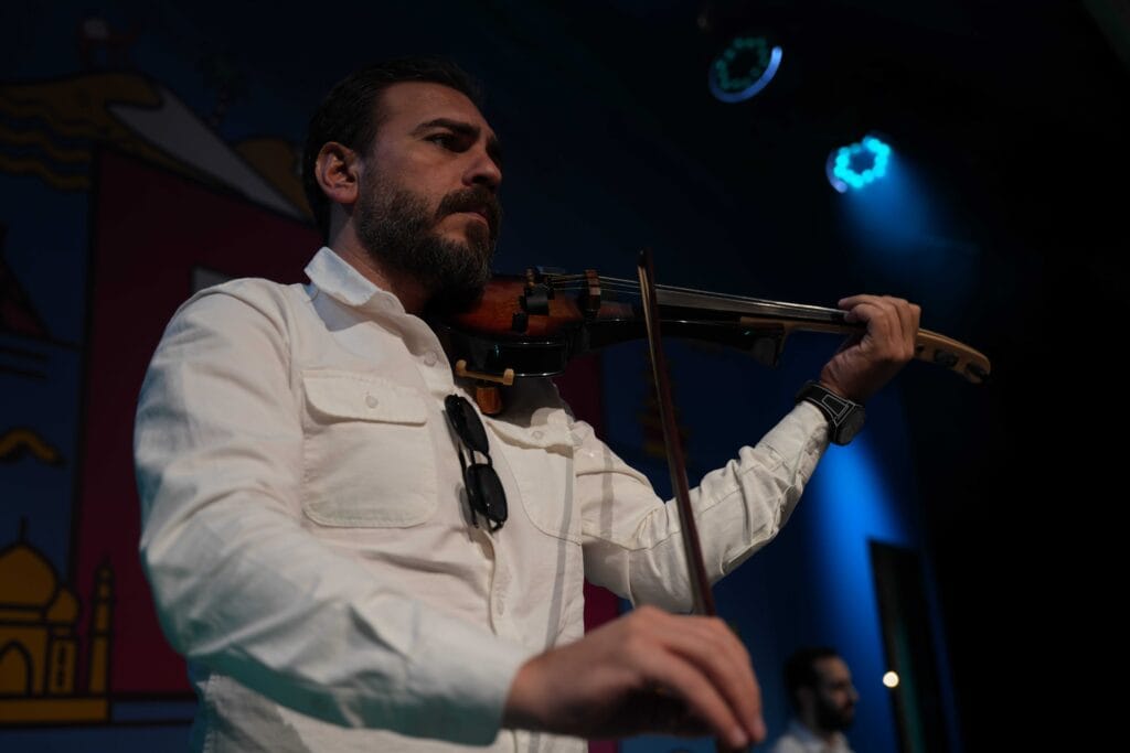 Man playing electric violin.