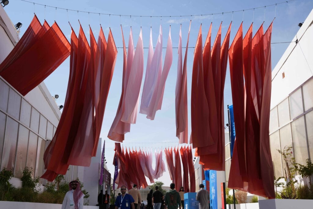 Colorful fabrics hanging outdoors.