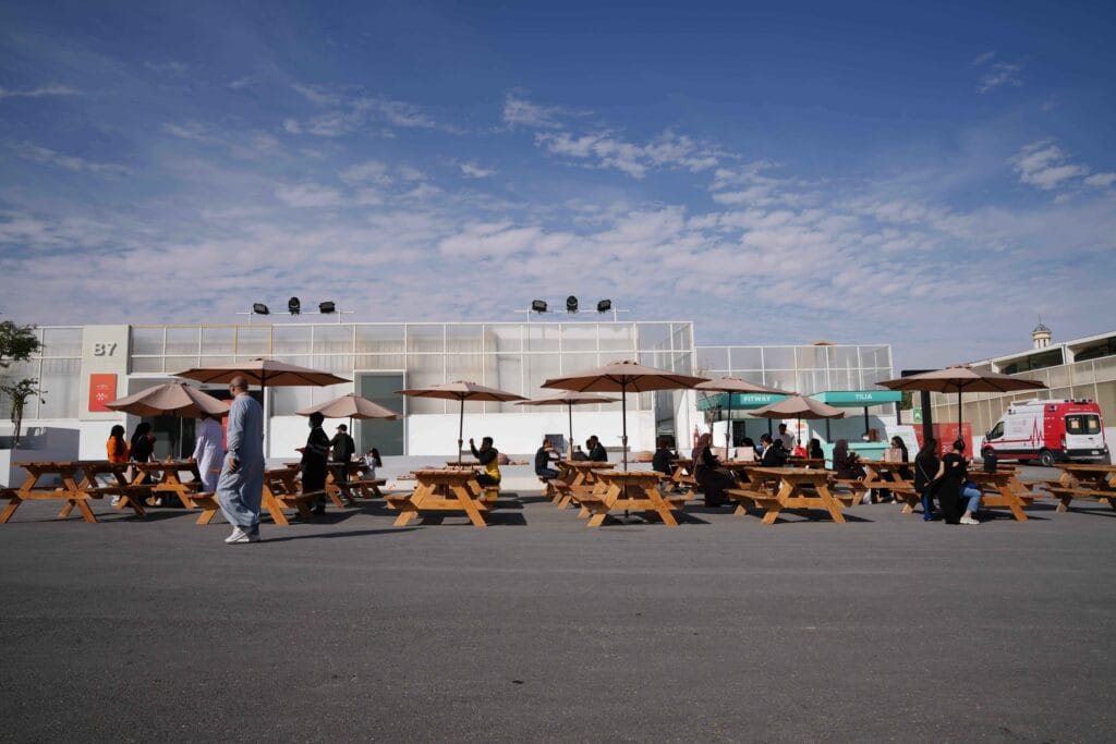 Outdoor picnic area with people.