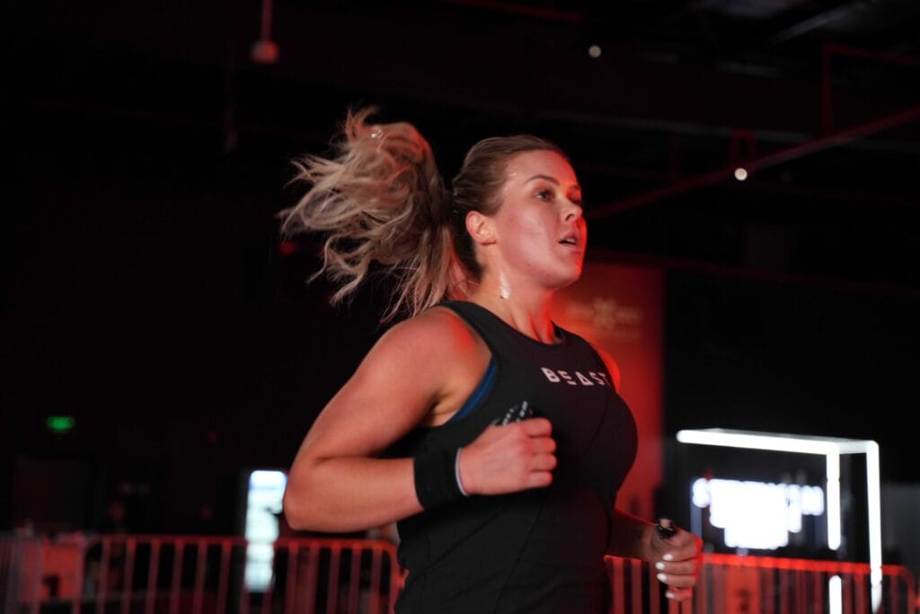 Woman running, intense workout.