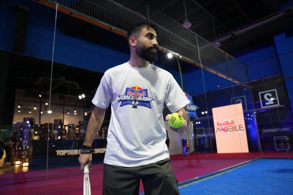 Man playing padel, Red Bull event.