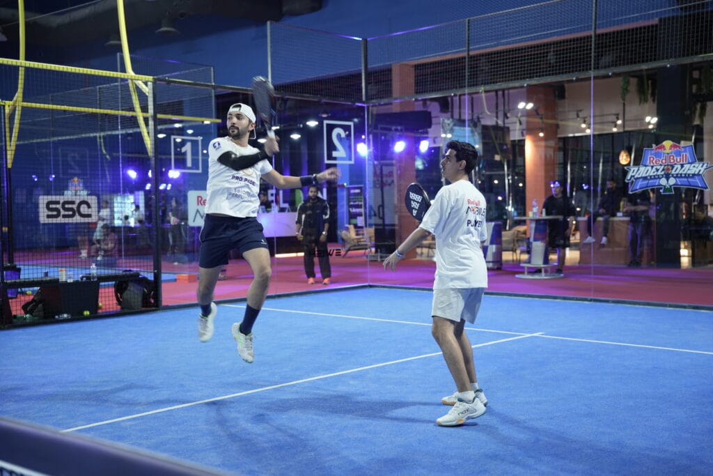 Padel players in action.