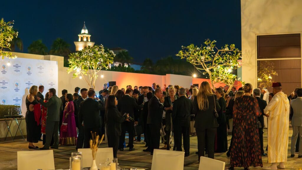 Outdoor dinner party at dusk.