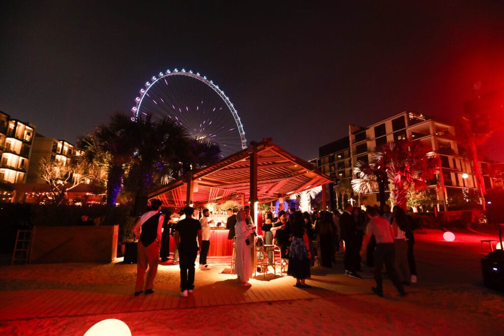 Night beach party, Ferris wheel.